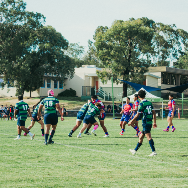 Fountain Gate Secondary College rugby teams playing a match on a sunny oval